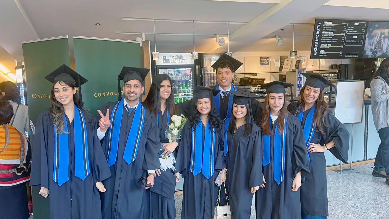 Andres Viloria Garcia at Convocation posing with some of his classmates