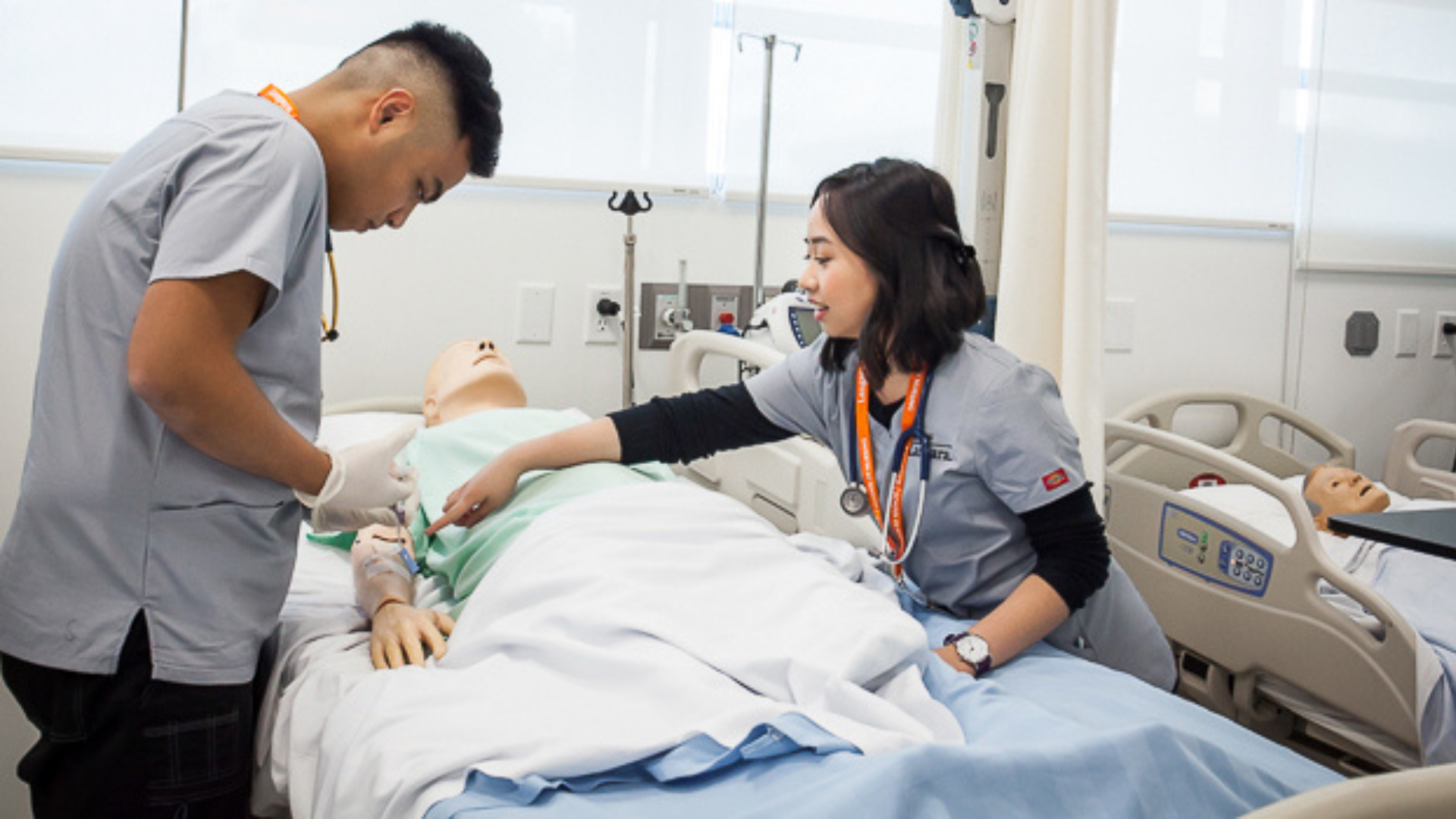 Two nurses with a mannequin
