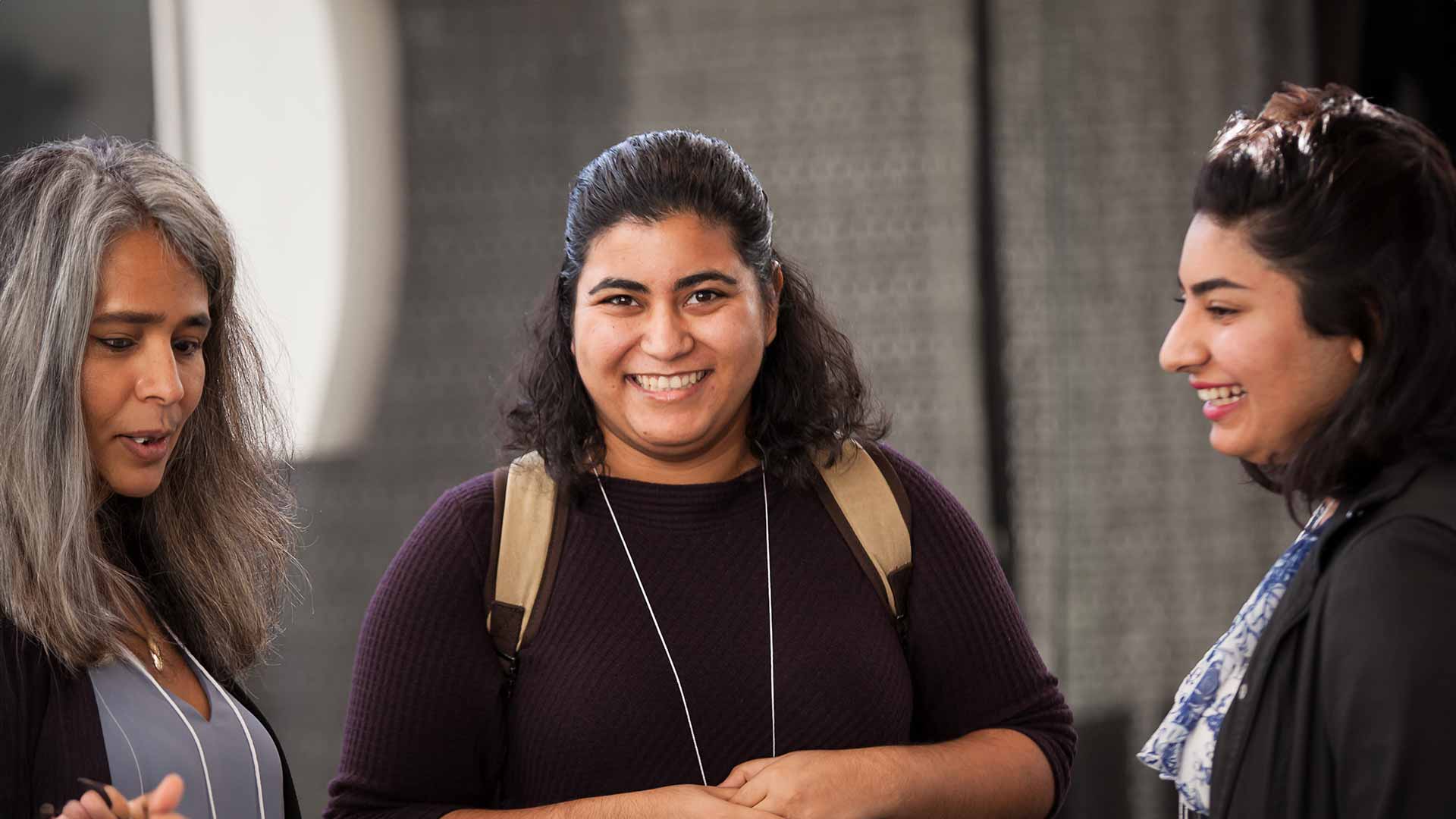 A student passionately shares her transformative journey at Langara, captivating her classmates in the vibrant T Building 