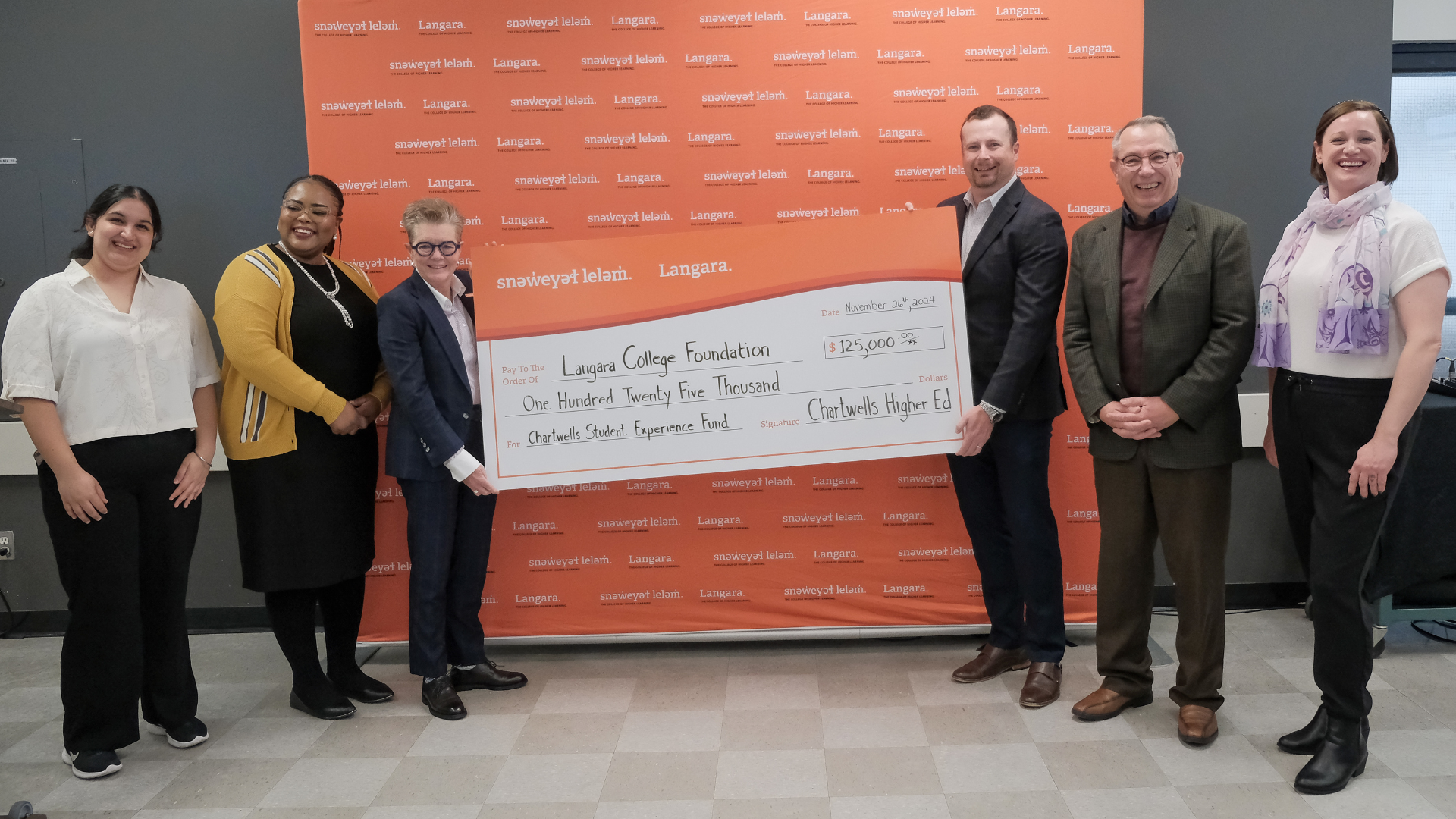 Cheque presentation from Chartwells to Langara College.