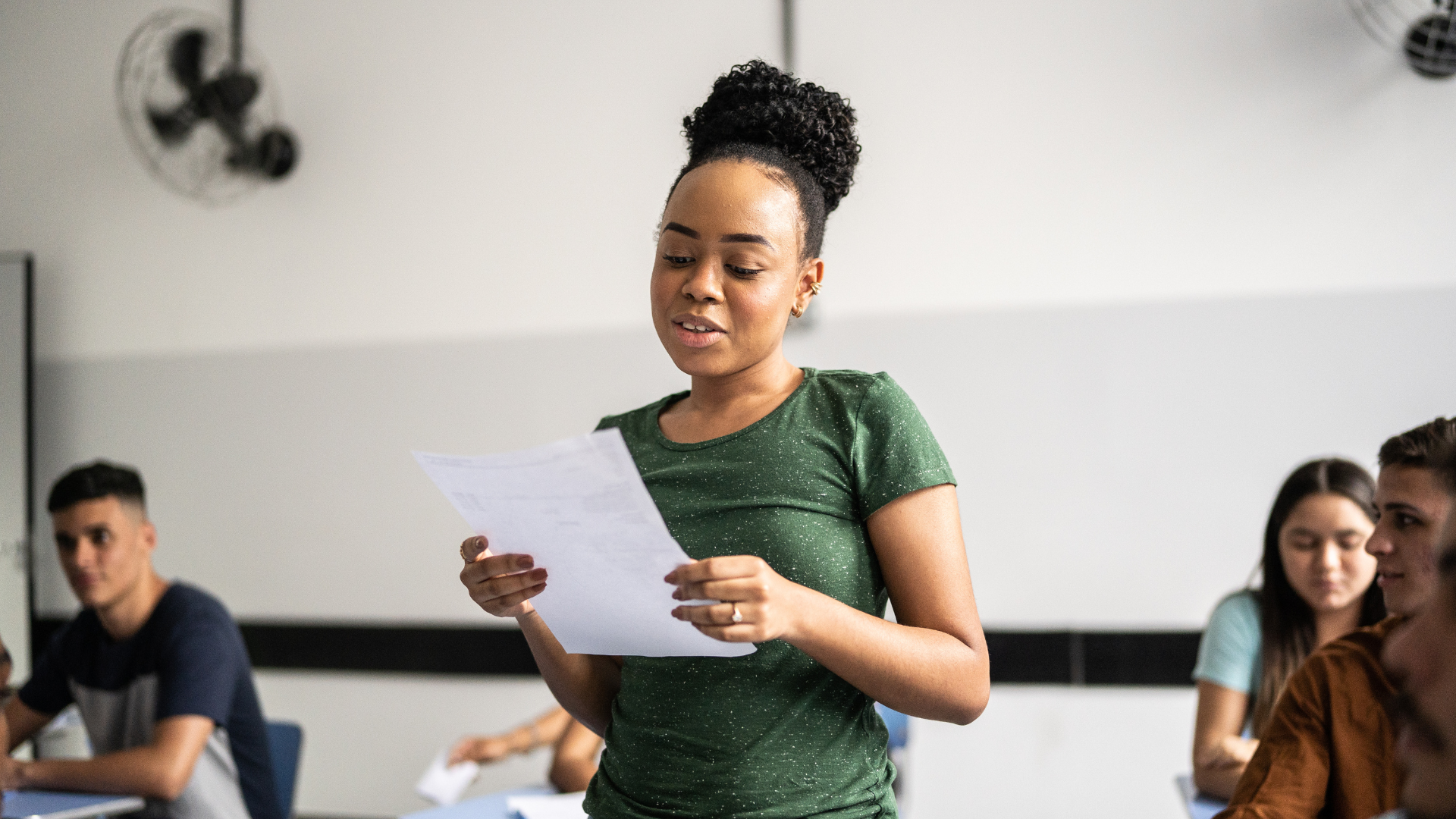 Student reads from paper.