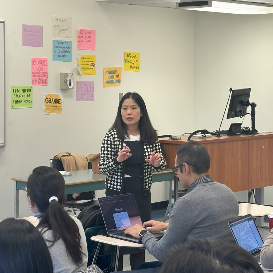 Instructor Monica Nguyen in front of her class