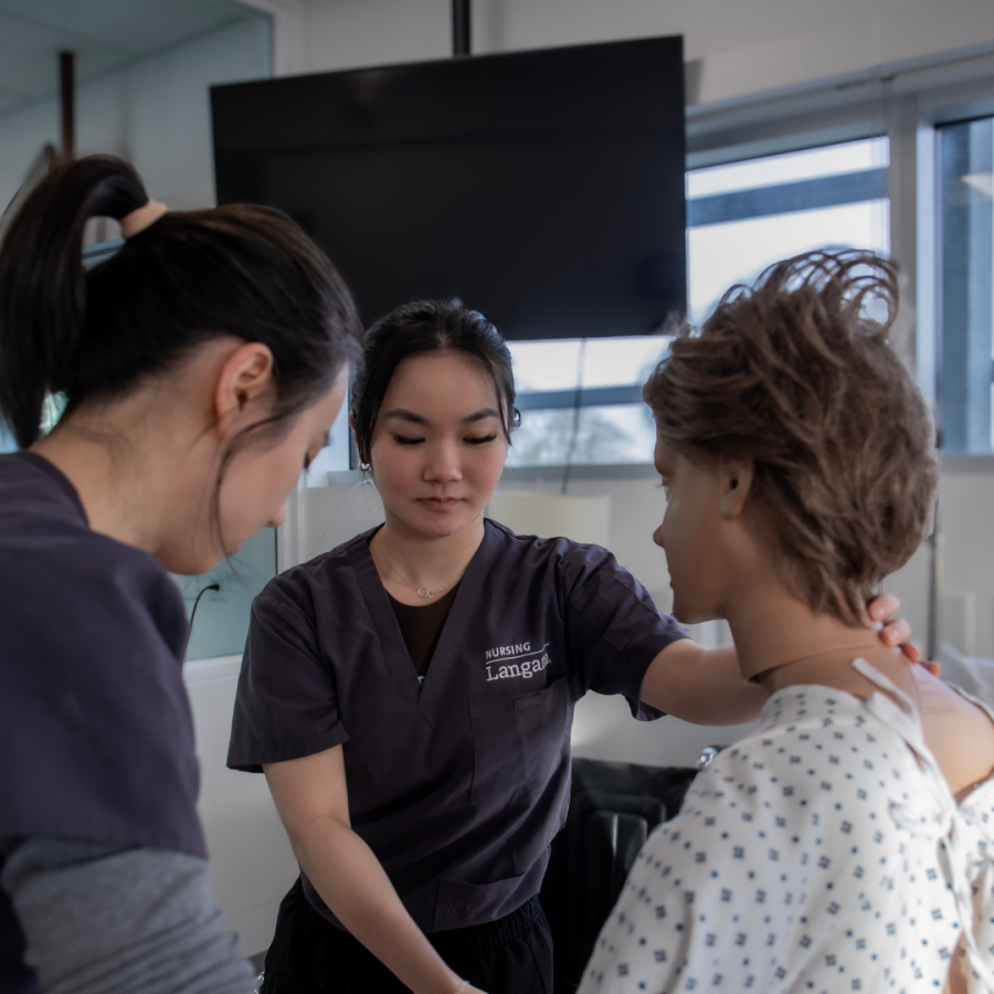 Student Theresa Mah with a mannequin