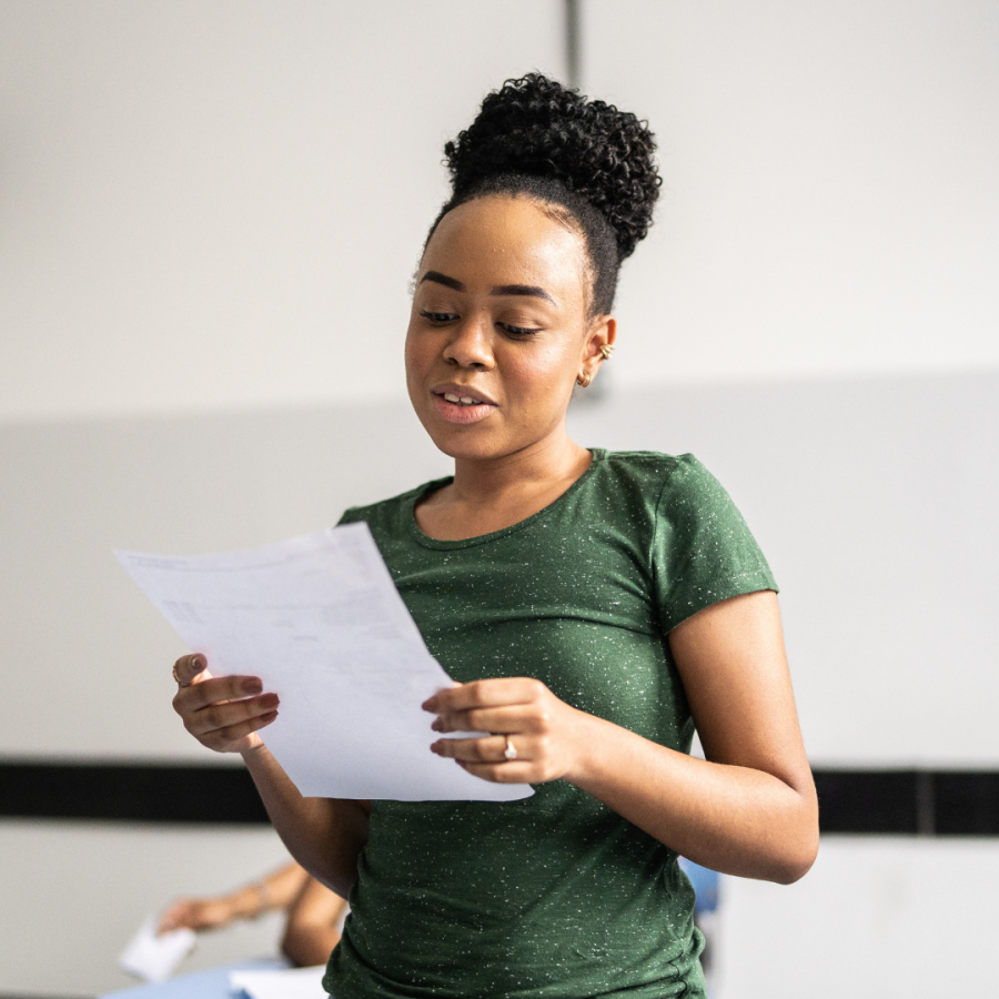 Student reads from paper.