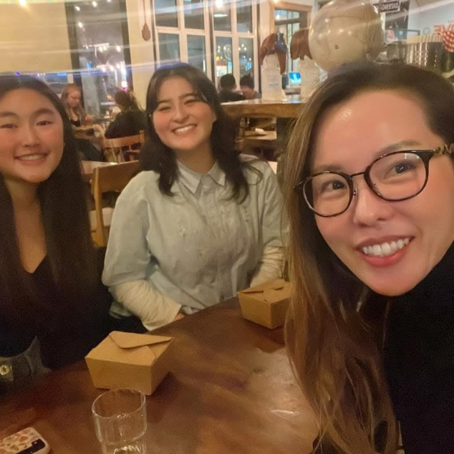 student, alumni and educator take a selfie