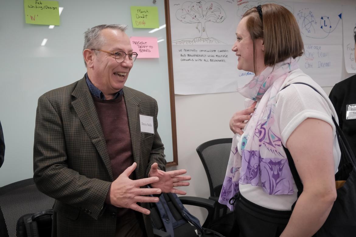 Charwell Team Member Denis Salle speaks with Nutrition and Food Services Management student Adriana Purdie.