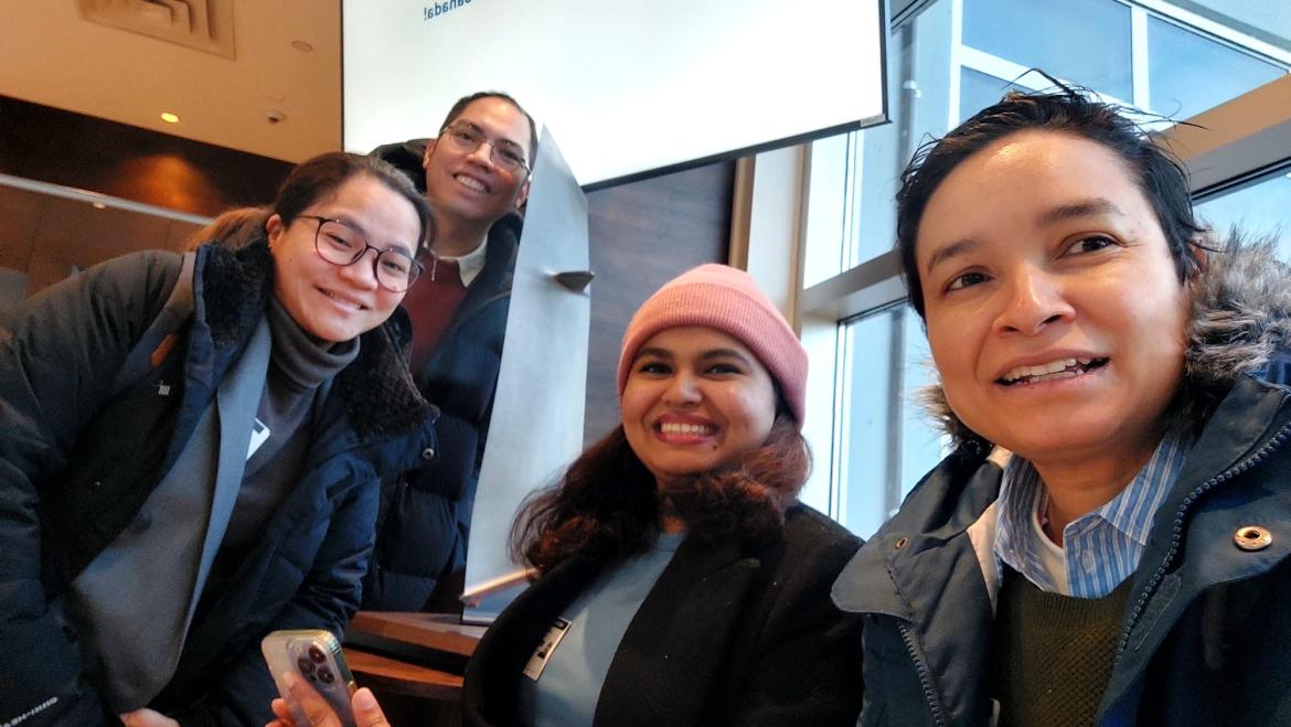 Erwin Garing poses with three fellow SCL practicum students.