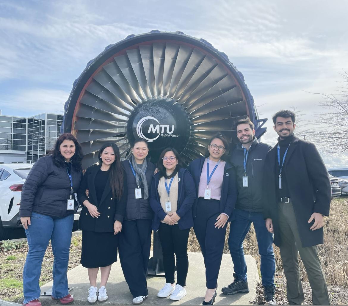 Grace Wang poses at MRU with a practicum cohort.
