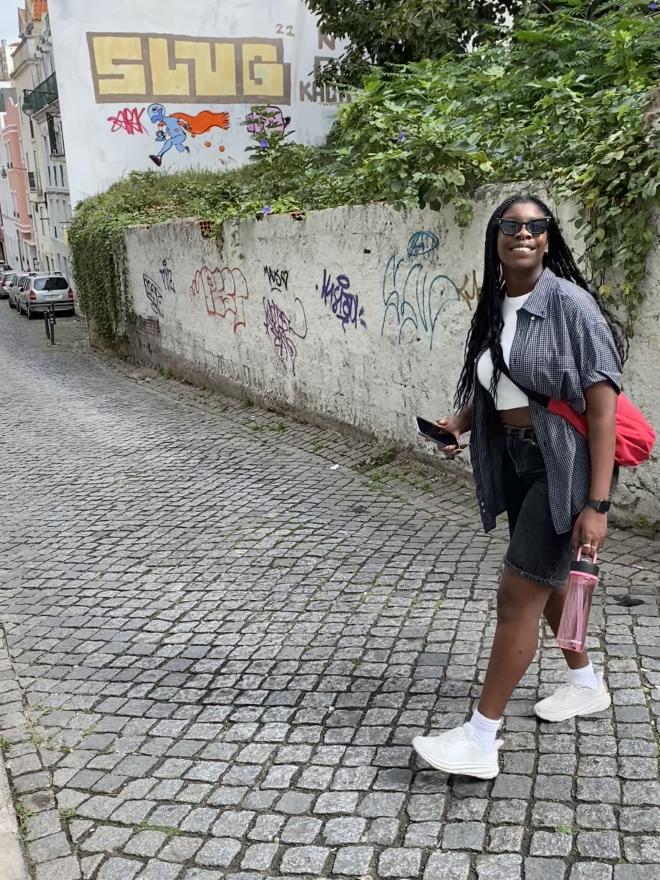 A photo of Ivy Charles on a city street.