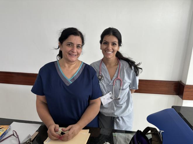 Robin Khanna poses with a fellow nurse as part of Operation Rainbow.