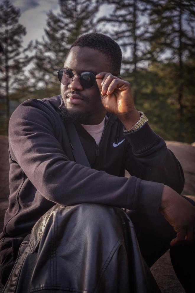 Yusuf Garuba wearing sunglasses.
